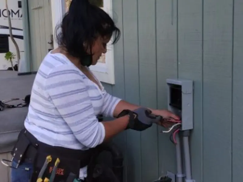 Licensed electrician wiring an exterior subpanel in Verona