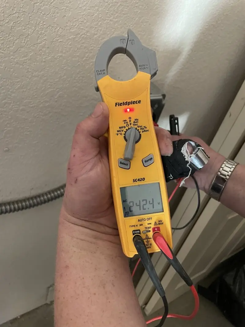 Voltage testing with clamp meter during Ceiling Fan Installation in Verona